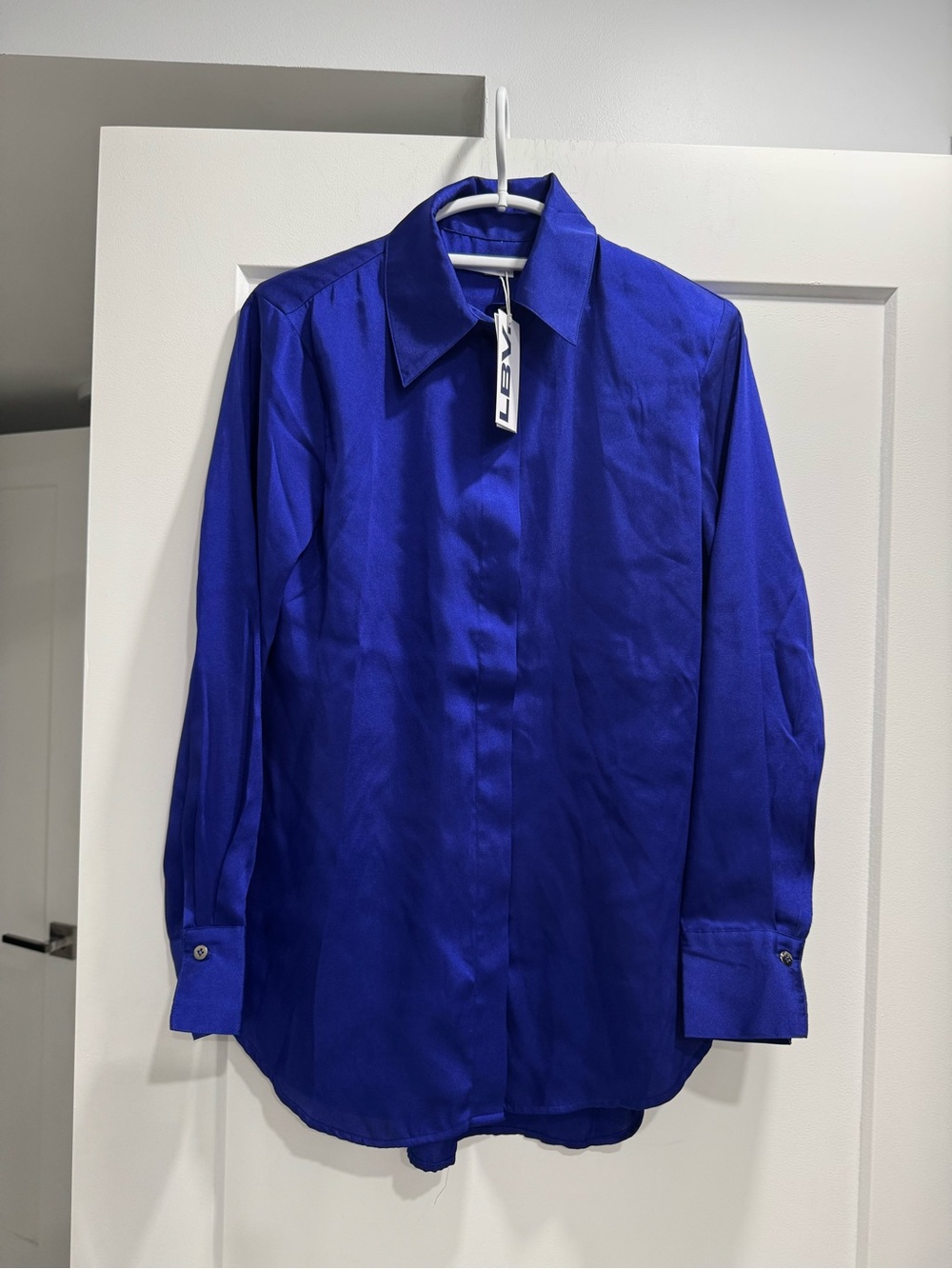 Women’s Royal Blue Long-Sleeve Button Shirt. Hidden silver buttons. Size XS